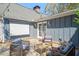 Inviting patio featuring stylish seating, a retractable screen, and charming string lights at 53 Weatherstone Pkwy, Marietta, GA 30068