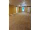 Spacious basement with tan carpet and white trim at 5915 Windsorcreek Dr, Douglasville, GA 30135