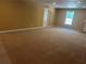 Spacious basement with tan carpet and white trim at 5915 Windsorcreek Dr, Douglasville, GA 30135