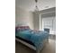 This bedroom features a chandelier and a large window at 5915 Windsorcreek Dr, Douglasville, GA 30135