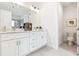 Bright bathroom featuring a double vanity with white cabinets and a neutral countertop at 2029 Memorial Dr # 32, Atlanta, GA 30317