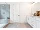 Bathroom featuring a large white door and a double vanity with granite countertops at 2029 Memorial Dr # 32, Atlanta, GA 30317