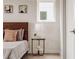 Bedroom close-up with side table and views of throw pillows at 2029 Memorial Dr # 32, Atlanta, GA 30317