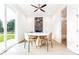 Bright dining area with a round table, modern chairs, and a view of the backyard and en-suite bathroom at 2029 Memorial Dr # 32, Atlanta, GA 30317