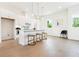 Bright, open kitchen featuring a white island with seating and modern pendant lights at 2029 Memorial Dr # 32, Atlanta, GA 30317