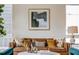 Cozy living room showcasing a stylish leather sofa with decorative pillows, art, and decor at 2029 Memorial Dr # 32, Atlanta, GA 30317