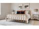 Well-lit main bedroom with a golden bed frame, decor, lamps, and a rug at 2029 Memorial Dr # 32, Atlanta, GA 30317