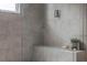 Close-up of an elegant shower with a built-in bench and contemporary gray tiling at 2029 Memorial Dr # 32, Atlanta, GA 30317