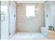 Luxurious shower with dual showerheads, a built-in bench, and contemporary tile at 2029 Memorial Dr # 32, Atlanta, GA 30317