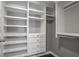 Walk-in closet with custom shelving and ample storage space for an organized wardrobe at 2769 Peachtree Ne Rd # 10, Atlanta, GA 30305