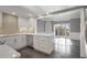 Open-concept kitchen with stainless appliances, marble counters, and view to dining room with natural light at 2769 Peachtree Ne Rd # 10, Atlanta, GA 30305