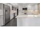 Modern kitchen features stainless steel appliances, a wine cooler, white cabinetry, and marble countertops at 2769 Peachtree Ne Rd # 10, Atlanta, GA 30305