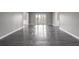 Spacious living room with hardwood floors and large window with view of mature trees at 2769 Peachtree Ne Rd # 10, Atlanta, GA 30305