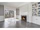 Bright living room with fireplace, built-in shelving, and access to a balcony with a nature view at 2769 Peachtree Ne Rd # 10, Atlanta, GA 30305