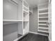 Spacious walk-in closet with custom white shelving and dark wood floors, ready for organization at 2769 Peachtree Ne Rd # 10, Atlanta, GA 30305