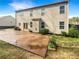 Spacious backyard featuring a large patio area, lush green lawn, and well-maintained landscaping at 3305 Pleasant Manor Ct, Cumming, GA 30028
