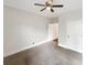 Bedroom with ceiling fan, neutral carpet, and an open door frame at 3305 Pleasant Manor Ct, Cumming, GA 30028