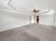 Bedroom with carpeted floor, ceiling fan, and tray ceiling at 3305 Pleasant Manor Ct, Cumming, GA 30028
