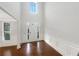 Grand foyer with hardwood floors, wainscoting, and soaring ceilings for an elegant and welcoming entrance at 3305 Pleasant Manor Ct, Cumming, GA 30028