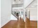 Inviting foyer with hardwood floors, staircase and view into other rooms at 3305 Pleasant Manor Ct, Cumming, GA 30028