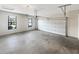 Garage with concrete flooring, windows, and a white garage door at 3305 Pleasant Manor Ct, Cumming, GA 30028