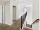 Hallway with carpeted floor and railings that overlook the stairs at 3305 Pleasant Manor Ct, Cumming, GA 30028