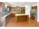 Beautiful kitchen featuring wooden cabinets, granite countertops, stainless steel appliances, and a central island at 3305 Pleasant Manor Ct, Cumming, GA 30028