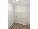 Utility room with tile flooring and a wire shelf at 3305 Pleasant Manor Ct, Cumming, GA 30028