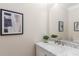 Elegant half bathroom with a marble vanity top, modern fixtures, and stylish decor at 3895 Overlake Dr, Cumming, GA 30041