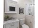 Modern bathroom featuring a marble countertop, decorative mirror and an enclosed glass shower at 3895 Overlake Dr, Cumming, GA 30041