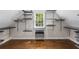 Spacious walk-in closet with custom shelving and hardwood floors, perfect for organized storage at 3895 Overlake Dr, Cumming, GA 30041