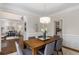 Stylish dining room with hardwood floors, modern lighting, and easy access to other living areas at 3895 Overlake Dr, Cumming, GA 30041