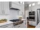 Well-equipped kitchen with white cabinetry, stainless steel appliances, and modern finishes at 3895 Overlake Dr, Cumming, GA 30041