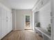Bright mud room featuring custom cabinets, bench seating, shiplap accent wall, and access to the exterior at 3895 Overlake Dr, Cumming, GA 30041