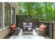 Cozy patio with a seating area, perfect for enjoying outdoor relaxation and entertaining at 3895 Overlake Dr, Cumming, GA 30041