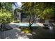 Home with a pool surrounded by a deck, and lush landscaping at 4 W Wesley Nw Rdg, Atlanta, GA 30327