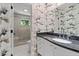Stylish bathroom features granite countertops, modern fixtures, and a glass-enclosed shower at 4 W Wesley Nw Rdg, Atlanta, GA 30327