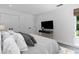 Bright bedroom features modern decor, hardwood floors, and a comfortable queen-sized bed at 4 W Wesley Nw Rdg, Atlanta, GA 30327