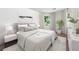 Bright bedroom with neutral tones and modern decor creates a calming space with ample natural light at 4 W Wesley Nw Rdg, Atlanta, GA 30327