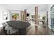 Spacious dining area adjacent to living room with a long table and modern chairs at 4 W Wesley Nw Rdg, Atlanta, GA 30327