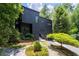 Stunning contemporary home with black exterior and lush landscaping at 4 W Wesley Nw Rdg, Atlanta, GA 30327