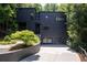 Contemporary home with a driveway and mature trees at 4 W Wesley Nw Rdg, Atlanta, GA 30327
