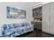 Living room with floral sofa, built-in wet bar, beverage fridge, and a decorative mirror at 4 W Wesley Nw Rdg, Atlanta, GA 30327