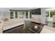 Spacious main bedroom boasts hardwood floors, large windows, and an entertainment center at 4 W Wesley Nw Rdg, Atlanta, GA 30327