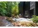 Backyard patio area with outdoor seating and lush greenery at 4 W Wesley Nw Rdg, Atlanta, GA 30327