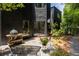 Back patio with seating, grill and lovely landscaping at 4 W Wesley Nw Rdg, Atlanta, GA 30327