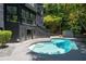 Beautiful in-ground pool surrounded by lush greenery and a modern home exterior at 4 W Wesley Nw Rdg, Atlanta, GA 30327