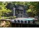 Modern home featuring a beautiful pool and deck at 4 W Wesley Nw Rdg, Atlanta, GA 30327