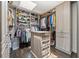 Spacious walk-in closet features custom shelving and storage, plus lots of natural light at 4 W Wesley Nw Rdg, Atlanta, GA 30327
