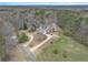Sprawling property from above, featuring lush green landscape and a long driveway for extra privacy at 905 Attaway Rd, Bowdon, GA 30108